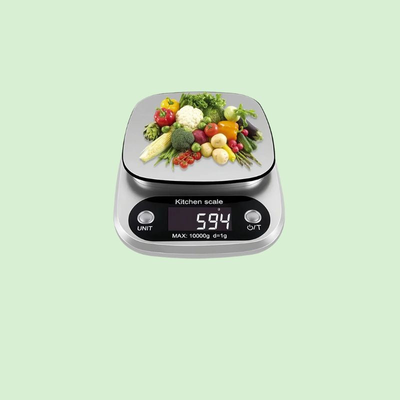 Balance de cuisine digitale en inox en train de peser des légumes avec précision de 1 g jusqu’à 10 kg
