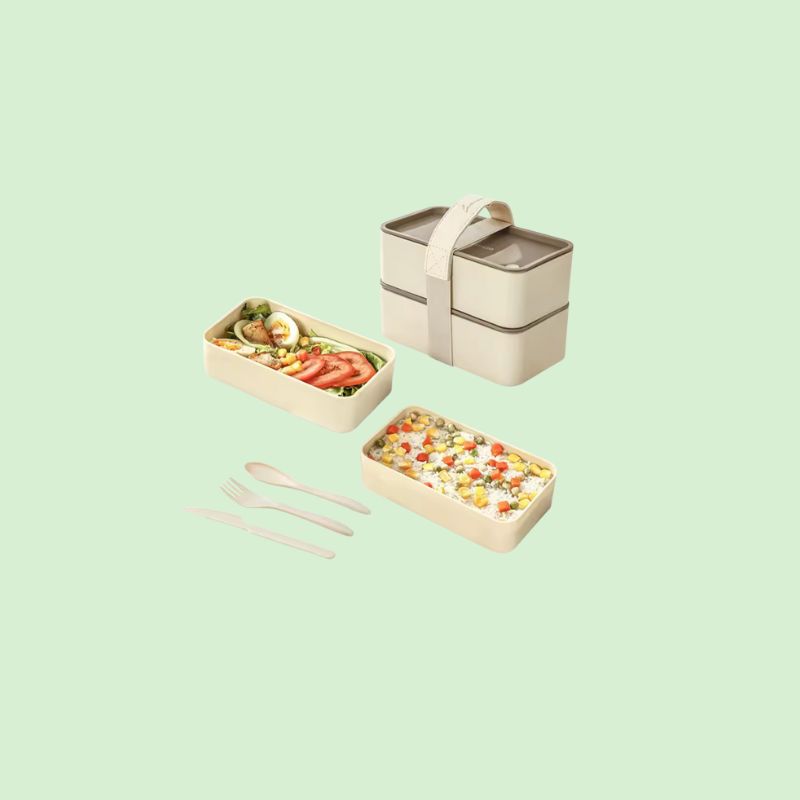 Boîte Bento Double Couche Hermétique complètement remplie de nourriture, montrant sa grande capacité et ses compartiments
