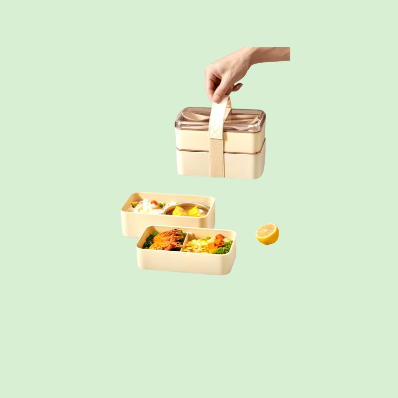Boîte Bento Double Couche Hermétique remplie d’aliments, montrant sa capacité et ses compartiments
