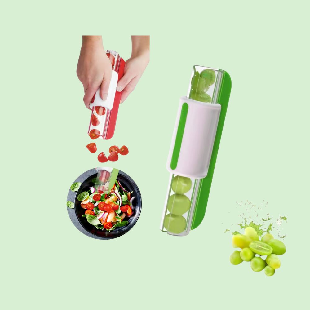 Coupe-fruits en action coupant des tomates directement sur une salade, avec des raisins à côté