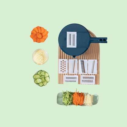 Coupe-légumes multifonction 12-en-1 entouré de légumes coupés de différentes manières montrant ses multiples fonctions