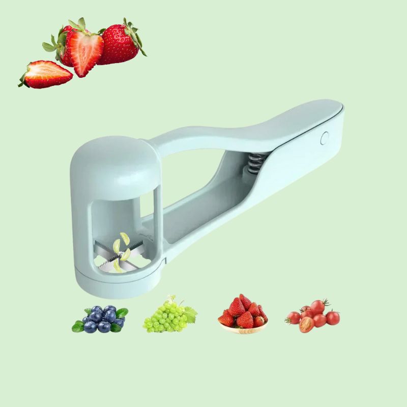 Coupe-raisin entouré de raisins, fraises et tomates pour montrer qu’il peut les couper en quartiers