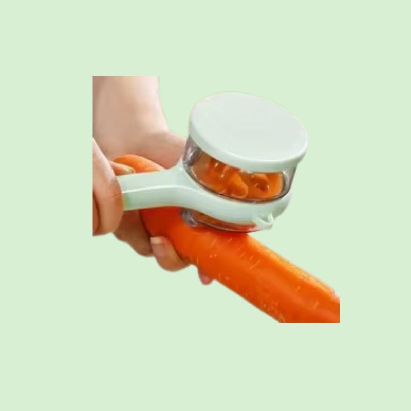 éplucheur avec bac récupérateur en action pour peler une carotte facilement