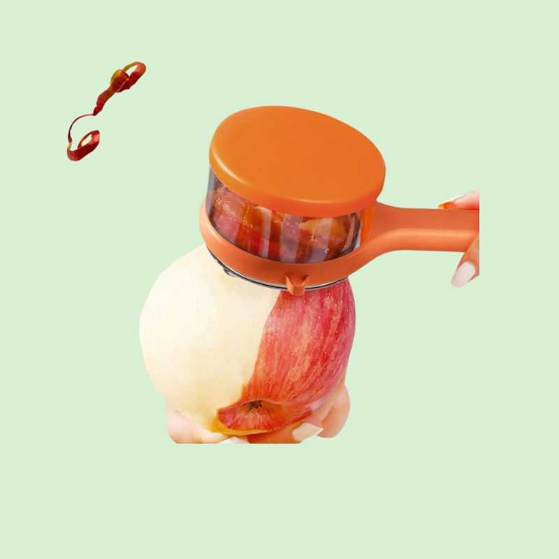 éplucheur avec bac récupérateur en action pour peler une pomme facilement