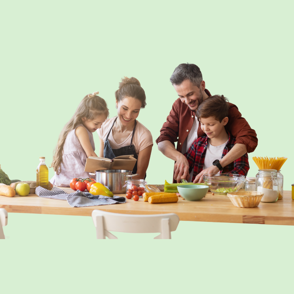 Famille heureuse en train de cuisiner ensemble dans une cuisine lumineuse, préparant un repas sain et équilibré