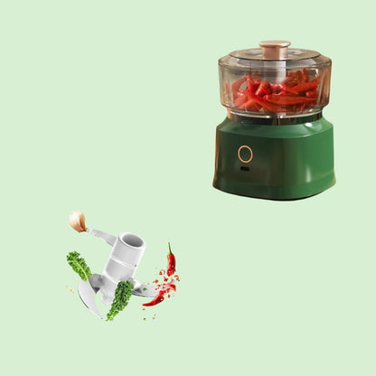 Mini hachoir électrique 350 ml mixant du piment avec lame visible.