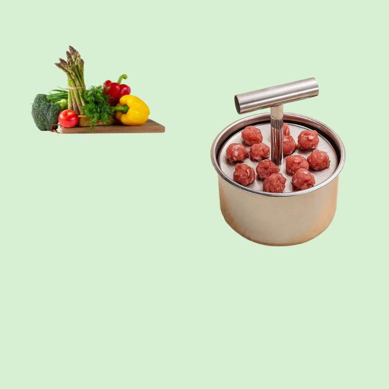 Moule à boulettes en inox placé à côté de légumes frais, idéal pour préparer des recettes saines et variées
