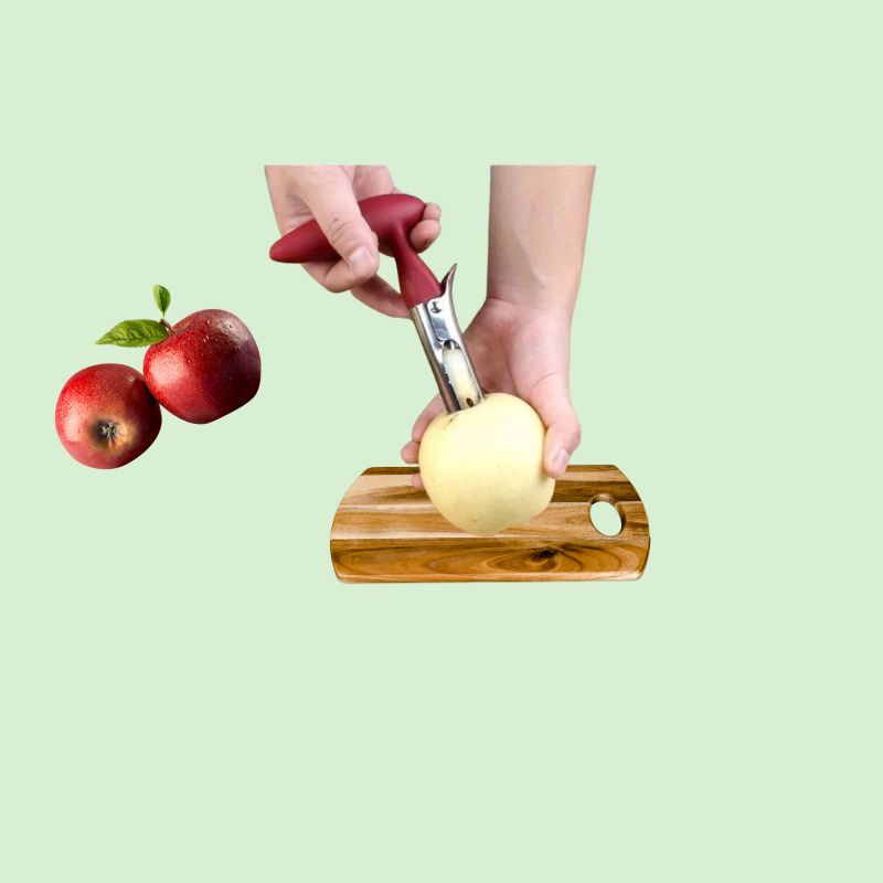 Vide-pomme en inox en train de retirer le cœur d’une pomme